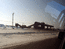 Вид на дробильную фабрику из машины с затемненными стеклами